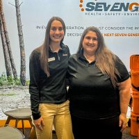 IMG_5573 two SevenGen female employees standing in a conference booth